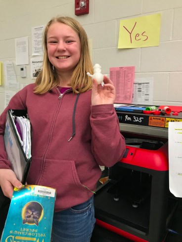 Isabella Korbet holds up her newly printed snowman