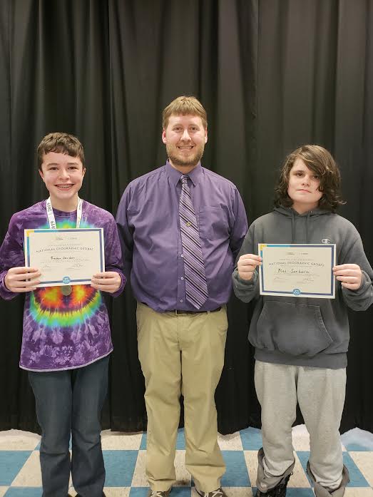 Pictured from left to right: Breckon Davidson, CMS social studies teacher Ryan Reed, and Max Sanborn.